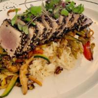 Seared Sesame Tuna · Served with stir fried veggies, ginger, ponzu, Over Rice.