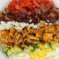 Spicy Buffalo Salad · Romaine, cabbage, crispy buffalo chicken, avocado, tomatoes, crumbled blue cheese, hard boil...