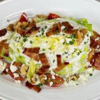 Wedge Salad · Iceberg lettuce, bacon, crumble bleu cheese, cherry tomatoes, bleu cheese dressing