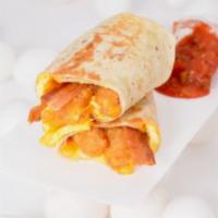 Bacon, Egg And Cheddar Burrito · 3 fresh cracked cage-free scrambled eggs, melted Cheddar cheese, smoky bacon and crispy pota...