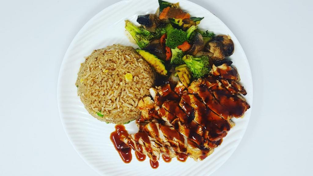 Chicken Teriyaki · Grilled marinated chicken breast in teriyaki sauce. Served with choice of side, steamed rice and grilled vegetables.