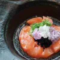 Bakkafrost Salmon Tartar · Diced salmon, tobiko, onion, and yuzu sauce.