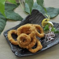 Crispy Calamari · Batter fried calamari ring and sweet chili sauce.