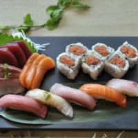 Sushi And Sashimi · Nine pieces sashimi and five pieces sushi with spicy tuna roll.