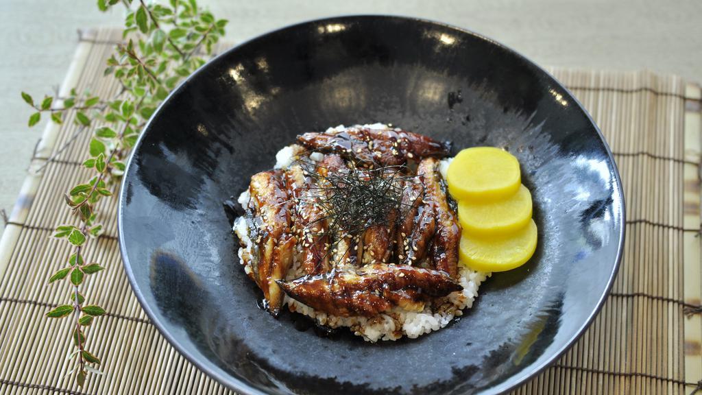 Unagi Don · Eight pieces eel over sushi rice.