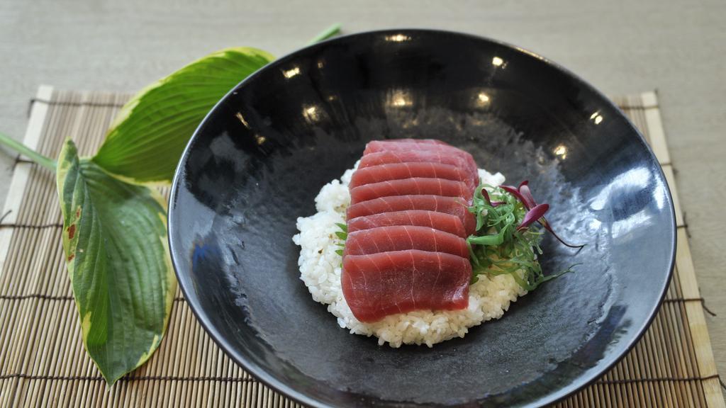 Tekka Don · Ten pieces tuna sashimi over sushi rice.