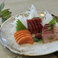 Tri-Color Sashimi · Five pieces tuna, five pieces salmon, and five pieces yellowtail.