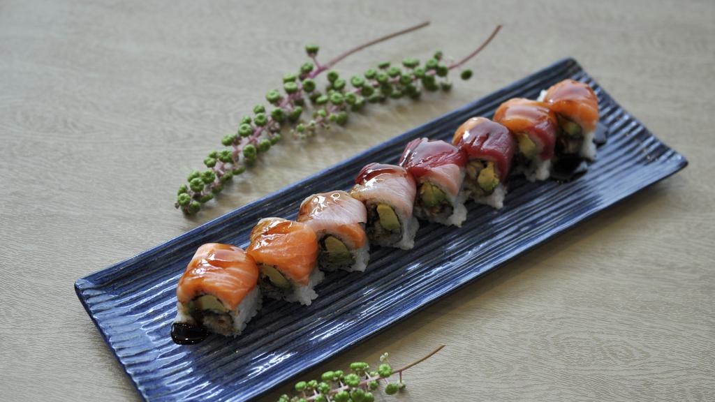 Viking Roll · Eel, avocado, crunchy, topped with tuna, salmon, yellowtail, and eel sauce.