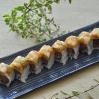 Sunny Flower Roll · Tuna, salmon, crunchy, topped with spicy scallop, tobiko, and scallion.