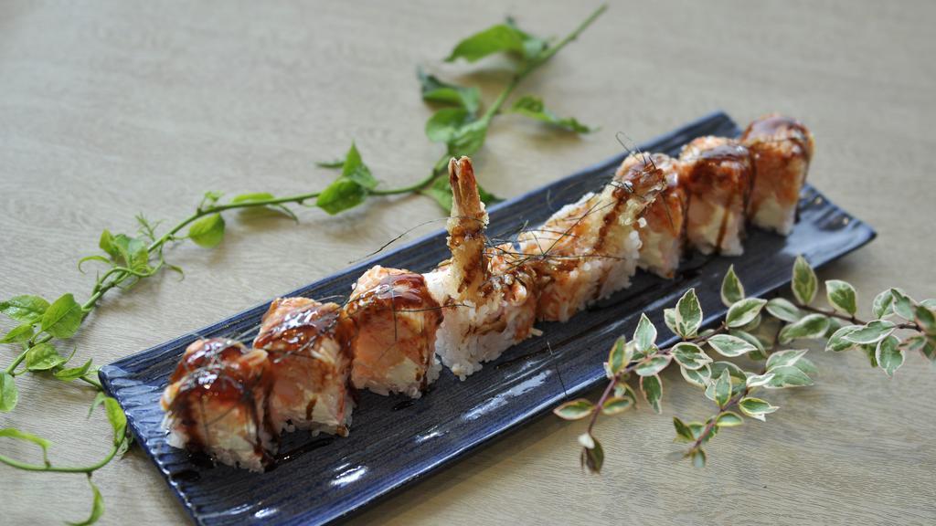 Angry Dragon Roll · Shrimp tempura, cream cheese, topped with spicy Kani, tobiko, and wrapped by soybean paper.