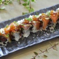 Amazing Roll · Black pepper tuna, tobiko, asparagus, topped with yellowtail, salmon, eel, ikura, scallion, ...