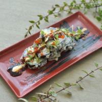 Volcano Roll · Deep-fried roll, white fish tempura, cream cheese, tobiko, scallion, avocado, and chef sauce.