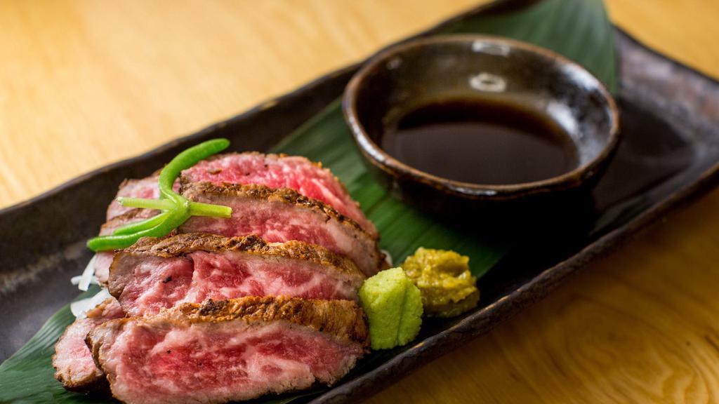 Wagyu Tataki · seared A5 wagyu beef with onion, ponzu, and chili yuzu
