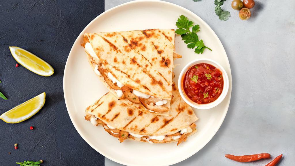 Shrimp Por Favor Quesadilla · Fresh shrimp seasoned and wrapped with cheese in a grilled tortilla with pico de gallo.