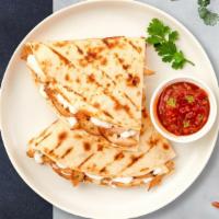 Veggie Quesadilla · Grilled seasonal vegetables wrapped with cheese in a grilled tortilla.