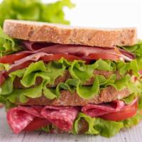 Salami Sandwich · Fresh avocado, pesto, olives, tomatoes, salami, and mozzarella on your choice of bread. Serv...