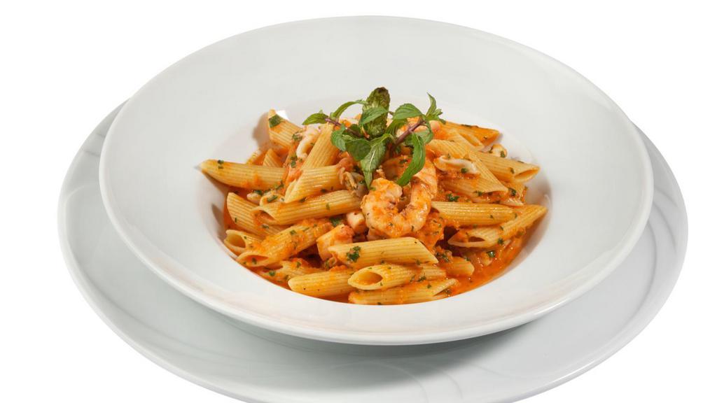 Penne Primavera · Sautéed onions, peppers, broccoli, mushrooms, and spinach on a chef's special garlic sauce on a bed of penne pasta. Choice of spice level and add-ons are available.