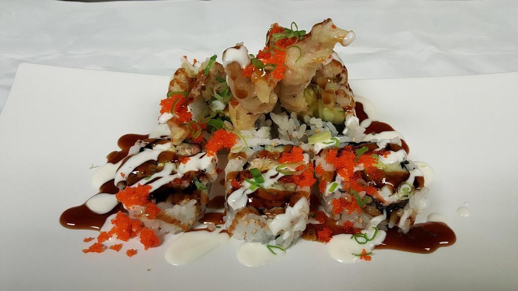 Spider Roll · Soft-shell crab tempura cucumber and avocado topped with masago and scallion.