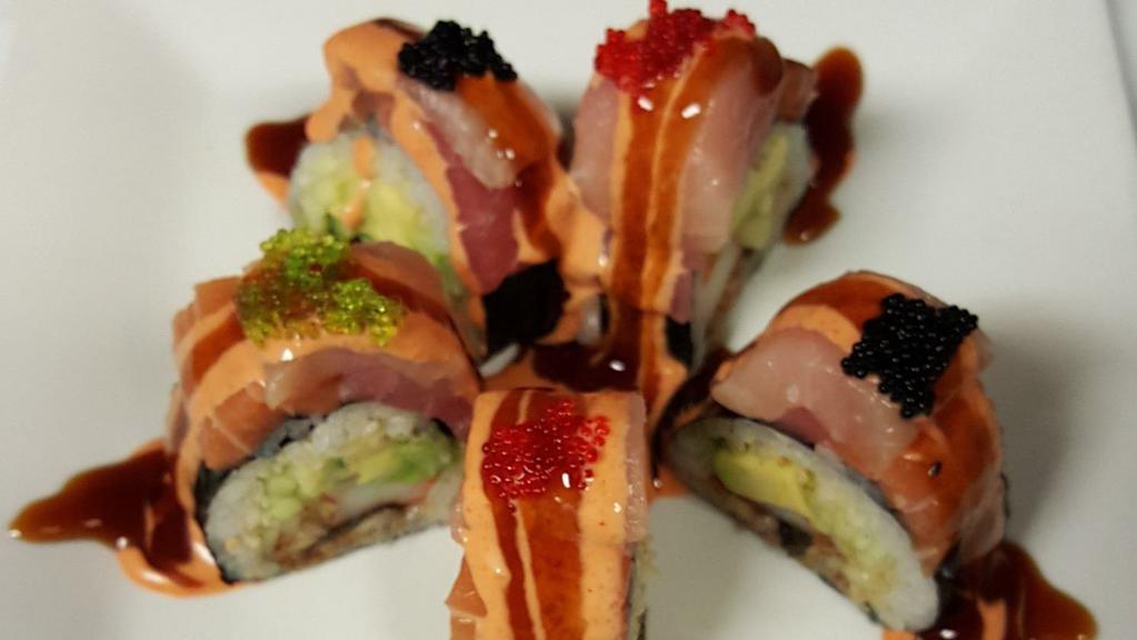 Kimono Roll · Crabmeat, avocado, eel, crunch, cucumber top with tuna, salmon, yellowtail and tobiko with eel sauce and spicy mayonnaise.