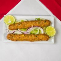 Chicken Seekh Kabab · Ground chicken seasoned with fresh herbs and spices sauteed.