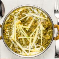 Palak Paneer · Fresh spinach cooked with cubes of homemade cheese mildly spiced.
