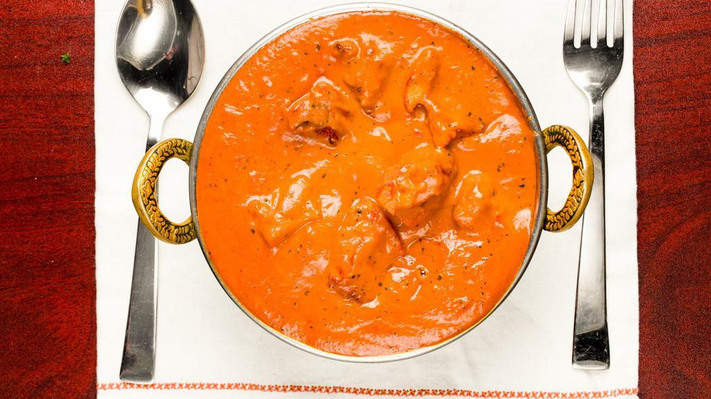 Chicken Makhani (Butter) · Roasted tandoori chicken with onion, tomato sauce, and heavy cream.