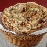 Garlic Naan · Unleavened bread topped with mildly spiced fresh garlic and cilantro.