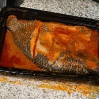 Grilled Fish (Whole Tilapia) · Tilapia prepared with assorted vegetables.
