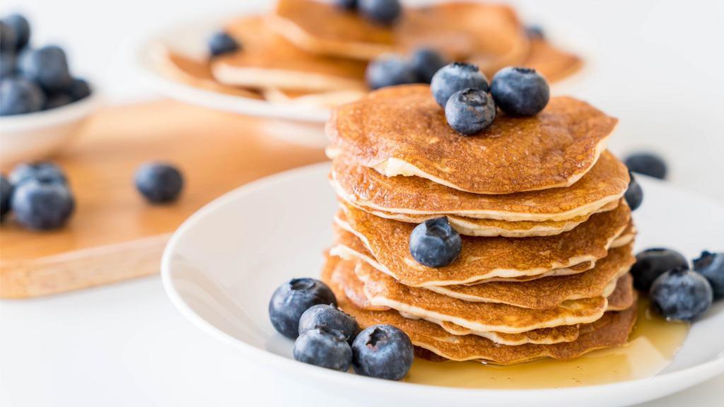 Blueberry Pancakes (3 Stack) · Fresh fluffy battered 3 stack of blueberry pancakes.