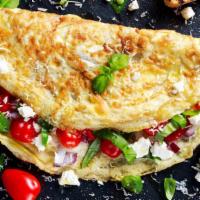 Greek Omelette Platter · Greek styled omelette with  fresh feta cheese, tomatoes, and three whole eggs. Served with h...