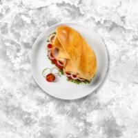 Deli Slice Sandwich · Turkey deli slice, lettuce, tomato, vegan mayo, and vegan cheese. Served on your choice of b...