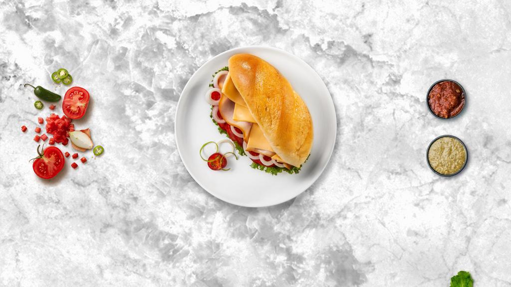 Deli Slice Sandwich · Turkey deli slice, lettuce, tomato, vegan mayo, and vegan cheese. Served on your choice of bread.