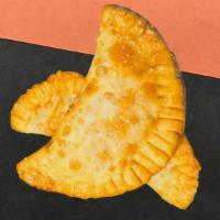 Vegan Curry Chik'N N Empanada · Flavorful and bold Curry Chik'n trapped inside crunch heaven!