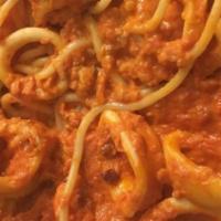 Calamari Alla Fra Diavolo · Served with choice of side.