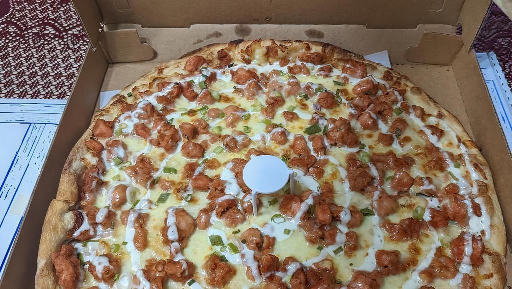 Buffalo Chicken Pizza Pie · Round pie crust with tender pieces of spicy buffalo chicken breast baked on top of homemade blue cheese dressing, topped with mozzarella.