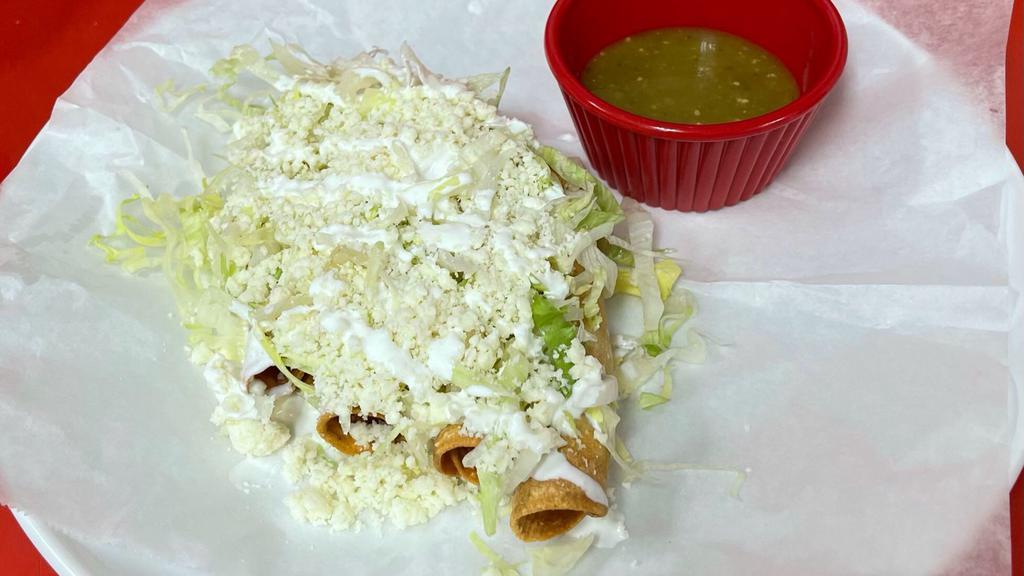 Tacos Dorado De Pollo  · (hard shell chicken taco). Topped with lettuce cheese Mexican cream