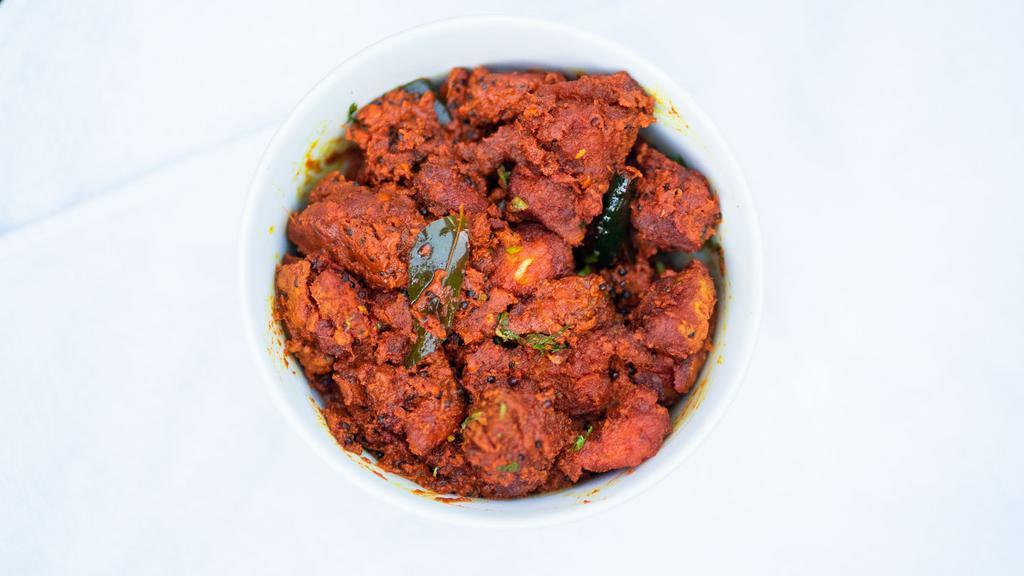 Chicken 65 · CHUNKS OF CHICKEN COOKED IN A SPICY YOGURT AND TAMPERED WITH WHOLE RED CHILI AND CURRY LEAVES.