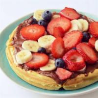 Strawberry Nutella Waffle · A fluffy Belgian waffle smothered in Nutella and topped with strawberries, maple syrup, and ...