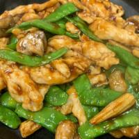 Chicken With Snow Pea Pods · Served with rice.