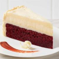 Red Velvet Cheesecake · Red Velvet Cake, creamy classic cheesecake, layered with rich cream cheese icing and finishe...