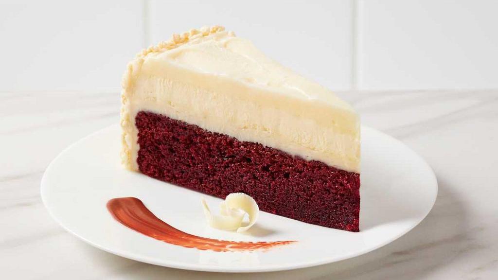 Red Velvet Cheesecake · Red Velvet Cake, creamy classic cheesecake, layered with rich cream cheese icing and finished with white chocolate curls.