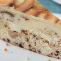 Cinnabon® Cake Cheesecake · A layer of Cinnabon® cinnamon cheesecake and vanilla crunch cake topped with cream cheese fr...