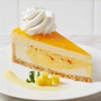 Mango Key Lime Cheesecake · Mango key lime cheesecake swirled with mango and topped with a mango mousse and glaze, on a ...