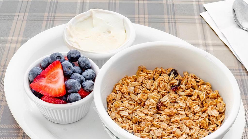 Yogurt And Granola Bowl · Granola with fresh berries and Greek yogurt.