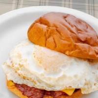 Breakfast Sandwich · Pork roll, 2 over easy eggs, and American cheese served on a brioche bun.