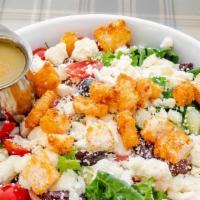 Chopped Greek Salad · Romaine, tomatoes, cucumber, Kalamata olives, feta, garlic croutons, and a classic Greek vin...