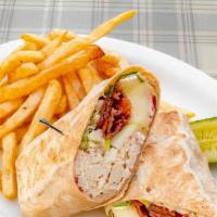 Harvest Wrap · Roasted turkey, brie cheese, granny smith apples, maple bacon, and a cranberry aioli in a wh...