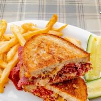 Reuben · Your choice of corned beef or fresh roasted turkey breast, sauerkraut, melted Swiss, Russian...