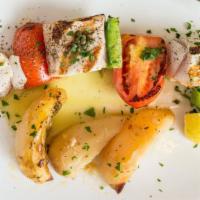 Swordfish · Skewered with grilled peppers and tomatoes with lemon potatoes.