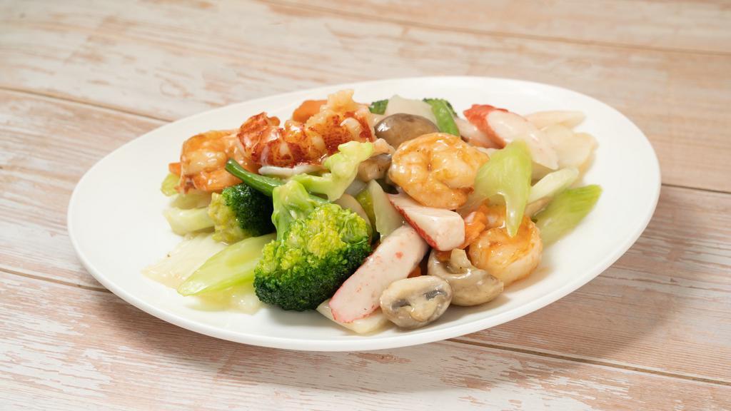 Seafood Combination · An incredible combination of lobster meat, jumbo shrimp, crab meat & scallions mixed with straw mushrooms, baby corn, Chinese vegetables & broccoli.